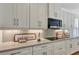 Sleek kitchen countertop with stainless steel appliances and decorative backsplash at 9149 Outlook Rock Trl, Windermere, FL 34786