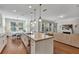Spacious kitchen with a large island, stainless steel appliances, and a dining area at 9149 Outlook Rock Trl, Windermere, FL 34786