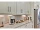 Clean kitchen countertop with stainless steel appliances and decorative elements at 9149 Outlook Rock Trl, Windermere, FL 34786
