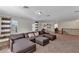 Second floor living room offers a large sectional sofa with a loft style open floor plan at 9149 Outlook Rock Trl, Windermere, FL 34786