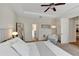 Spacious main bedroom features a ceiling fan, ensuite bathroom and ample natural light at 9149 Outlook Rock Trl, Windermere, FL 34786