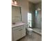 Bathroom featuring a glass-enclosed shower and white vanity with ample storage at 3219 Legends Preserve Dr, Daytona Beach, FL 32124