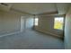 Spacious bedroom with tray ceiling, carpet flooring, and ample natural light at 3219 Legends Preserve Dr, Daytona Beach, FL 32124