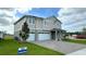 Beautiful two-story house featuring a well-maintained lawn and a spacious three-car garage at 3219 Legends Preserve Dr, Daytona Beach, FL 32124