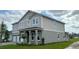 Elegant two-story home showcasing a manicured lawn and a spacious three-car garage at 3219 Legends Preserve Dr, Daytona Beach, FL 32124