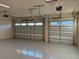 Spacious two-car garage with epoxy flooring and two doors at 3219 Legends Preserve Dr, Daytona Beach, FL 32124