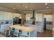 Modern kitchen with an island, white cabinetry, stainless appliances, and stylish pendant lighting at 3219 Legends Preserve Dr, Daytona Beach, FL 32124
