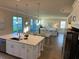 Open-concept living area with a kitchen island, dining area, and living room at 3219 Legends Preserve Dr, Daytona Beach, FL 32124