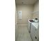Modern laundry room with a washer, dryer, and tiled floors at 3219 Legends Preserve Dr, Daytona Beach, FL 32124