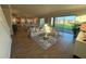 Spacious living room with tile flooring, modern furniture, and sliding doors leading to the backyard at 3219 Legends Preserve Dr, Daytona Beach, FL 32124