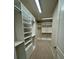 Walk-in closet with custom shelving for optimal organization at 3219 Legends Preserve Dr, Daytona Beach, FL 32124