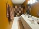 View of bathroom featuring dual sinks, spacious vanity, and updated fixtures at 466 Pepin Dr, Orlando, FL 32825