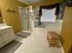 Bathroom with glass shower, soaking tub, and wooden bench at 466 Pepin Dr, Orlando, FL 32825