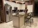 Well-equipped kitchen with stainless steel appliances, granite countertops, a breakfast bar, and ample cabinet space at 466 Pepin Dr, Orlando, FL 32825