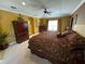 Well-appointed main bedroom with dark wood furniture, and tray ceiling at 466 Pepin Dr, Orlando, FL 32825
