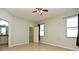 Bedroom with ceiling fan, walk-in closet, and neutral walls at 1155 Merion Dr, Mount Dora, FL 32757