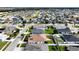 Aerial view of a house with a backyard and solar panels at 1080 Condor Dr, Haines City, FL 33844