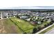 Aerial view showing community pool, playground, and large green space at 1080 Condor Dr, Haines City, FL 33844