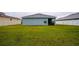 Large backyard with grassy lawn and privacy fence at 1080 Condor Dr, Haines City, FL 33844