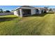 House with a screened-in patio and large backyard at 1080 Condor Dr, Haines City, FL 33844