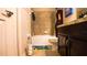 Bathroom with a tub, toilet and dark wood vanity at 1080 Condor Dr, Haines City, FL 33844