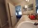 Double vanity bathroom with a view of the bedroom at 1080 Condor Dr, Haines City, FL 33844