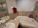 Bathroom with soaking tub and granite vanity at 1080 Condor Dr, Haines City, FL 33844
