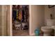 Bathroom with a toilet, walk-in closet, and shower at 1080 Condor Dr, Haines City, FL 33844