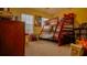 Attractive bedroom with a bunk bed, ample storage, and large window at 1080 Condor Dr, Haines City, FL 33844