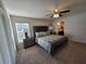 Bedroom with ceiling fan and sliding door access at 1080 Condor Dr, Haines City, FL 33844