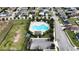 Aerial view of community pool, surrounding landscaping, and parking at 1080 Condor Dr, Haines City, FL 33844