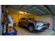 Attached garage with space for one vehicle and shelving at 1080 Condor Dr, Haines City, FL 33844