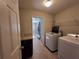 Laundry room with washer, dryer, and extra storage at 1080 Condor Dr, Haines City, FL 33844