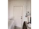 White door in laundry room leading to outside at 1080 Condor Dr, Haines City, FL 33844