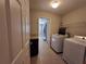 Laundry room with washer, dryer, and extra storage at 1080 Condor Dr, Haines City, FL 33844
