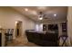 Living room with a dark brown couch and a large flat-screen TV at 1080 Condor Dr, Haines City, FL 33844