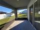 Spacious screened porch with sliding glass doors and view of the backyard at 1080 Condor Dr, Haines City, FL 33844