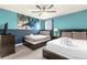 Bedroom with twin and full-size beds, a ceiling fan, and ocean mural at 1539 Flange Dr, Davenport, FL 33896