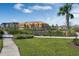 A landscaped community park area with playground, green space and walkable sidewalks, with new home construction in the background at 14038 Scarlet Aster Aly, Winter Garden, FL 34787