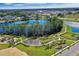 A high angle view highlights the community's walking trails, playground, dog park, and a pond in the center of the neighborhood at 14046 Scarlet Aster Aly, Winter Garden, FL 34787