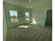 A bright, empty bedroom with neutral carpeting and two large windows at 14046 Scarlet Aster Aly, Winter Garden, FL 34787