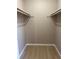 Walk-in closet with ample storage space at 5635 Devonbriar Way # 103, Orlando, FL 32822