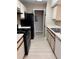Functional kitchen featuring appliances, white countertops, and ample cabinet space at 5635 Devonbriar Way # 103, Orlando, FL 32822