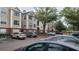 Exterior of the apartments features a tan color scheme and ample parking spaces for residents and visitors at 13103 Mulberry Park Dr # 824, Orlando, FL 32821