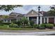 Charming clubhouse with classic architectural details and surrounded by beautifully landscaped gardens and lush greenery at 13103 Mulberry Park Dr # 824, Orlando, FL 32821