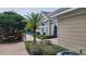 Outdoor patio with lush landscaping, offering a tranquil space for relaxation and socializing near the clubhouse at 13103 Mulberry Park Dr # 824, Orlando, FL 32821