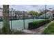 Well-maintained tennis court surrounded by greenery, offering residents a recreational space for sports and leisure at 13103 Mulberry Park Dr # 824, Orlando, FL 32821