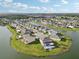 This is an aerial view of a community on a peninsula surrounded by water at 4949 Olivia Ct, St Cloud, FL 34772