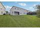 Lush green backyard featuring ample space and a screened-in lanai at 4949 Olivia Ct, St Cloud, FL 34772