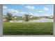 Picturesque backyard with a tranquil pond view, offering a serene and private outdoor retreat at 4949 Olivia Ct, St Cloud, FL 34772